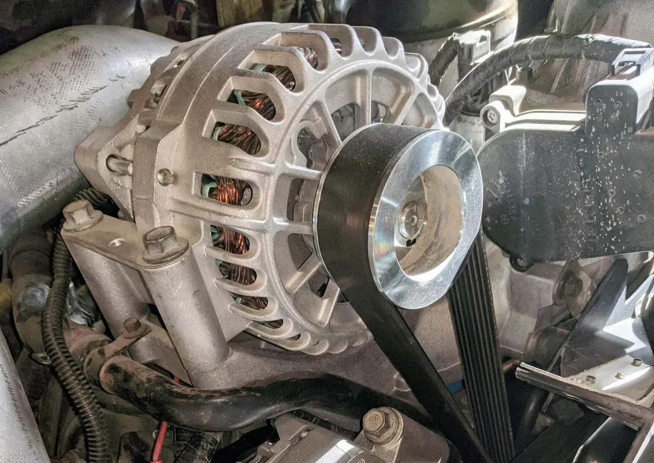 Close-up of a heavy-duty truck alternator