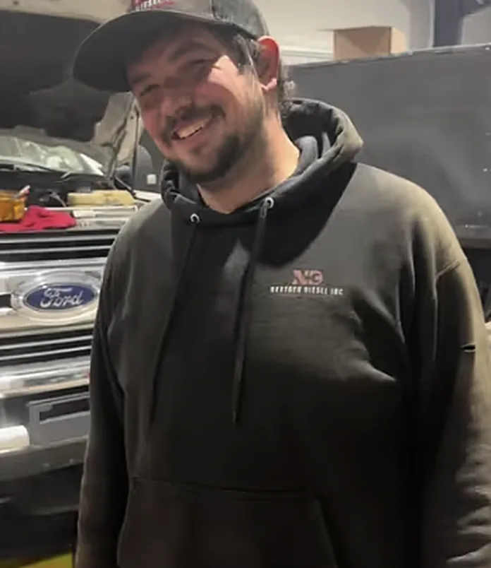 A smiling NextGen Diesel team member